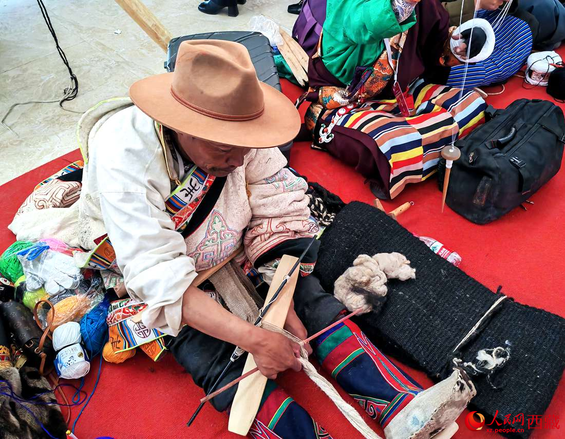 編織技能展示。人民網(wǎng) 李海霞攝