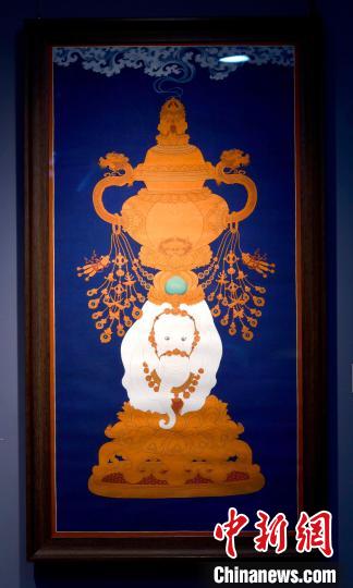 圖為5月16日，展覽中的新創(chuàng)唐卡作品《瑞象承香》?！±盍?攝